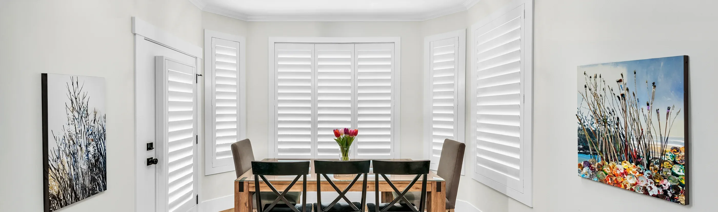 White shutters in a breakfast nook area