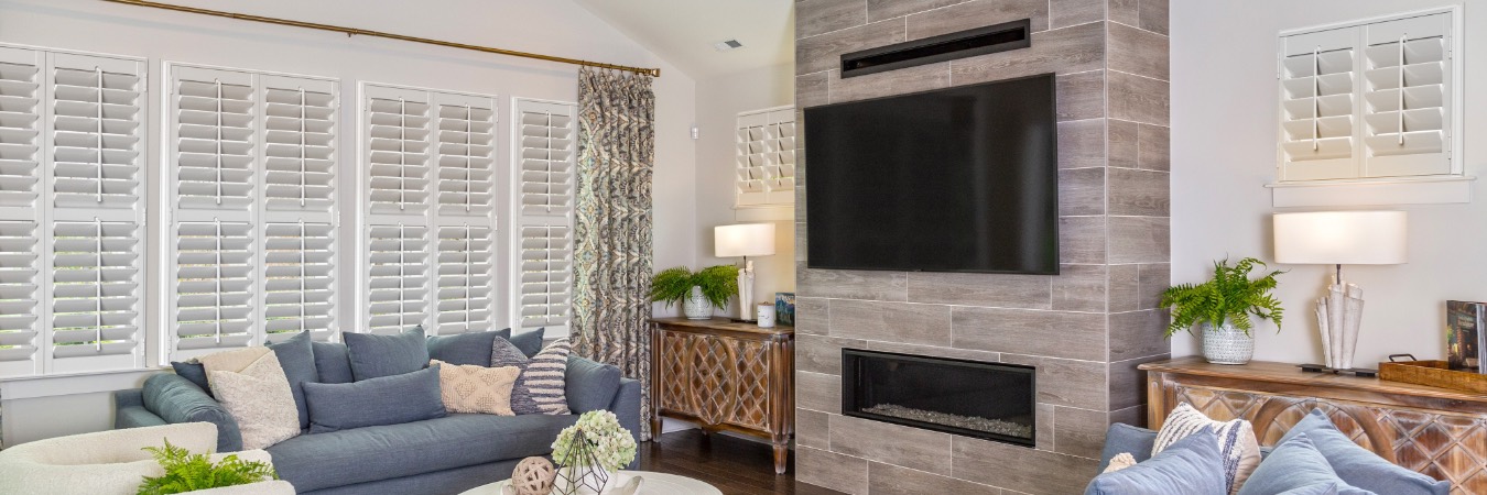 Interior shutters in Del Mar living room with fireplace
