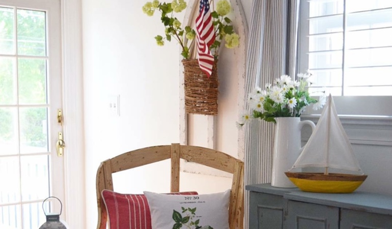 Bright sitting corner with faux wood plantation shutters in San Diego. Faux wood plantation shutters in San Diego