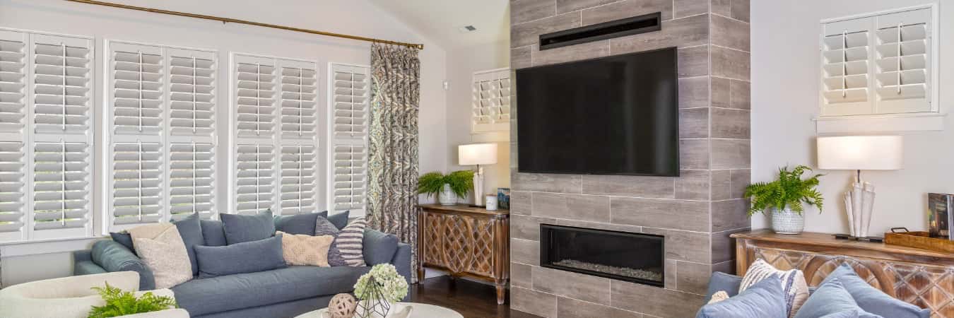 Interior shutters in Scripps Ranch living room with fireplace