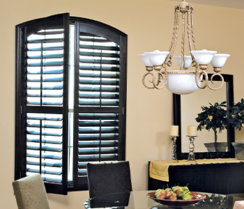 Ovation shutters above a modern fireplace