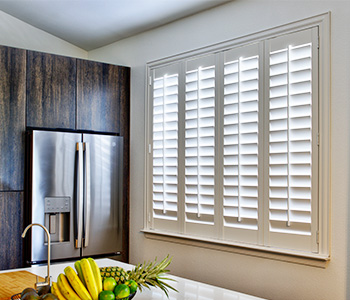 White Polywood shutters in a dining room