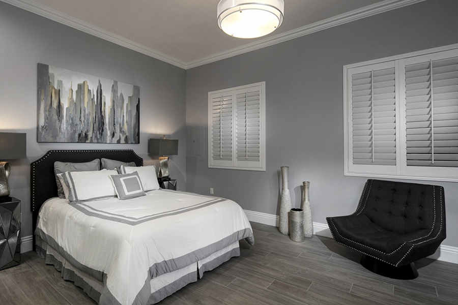 Close your custom Polywood shutters to beat the heat and keep your San Diego bedroom cool. White Polywood shutters on bedroom windows