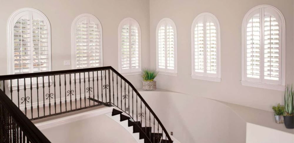 Polywood Shutters Over An Arched Staircase