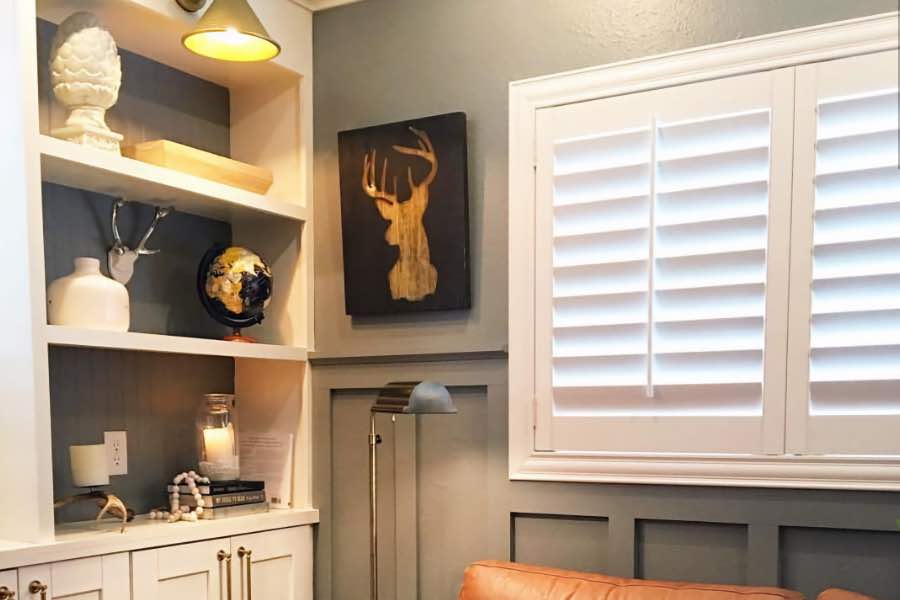 Pick a shutter frame that complements your decor and enhances your window's beauty Polywood shutters in a decorative frame above a couch