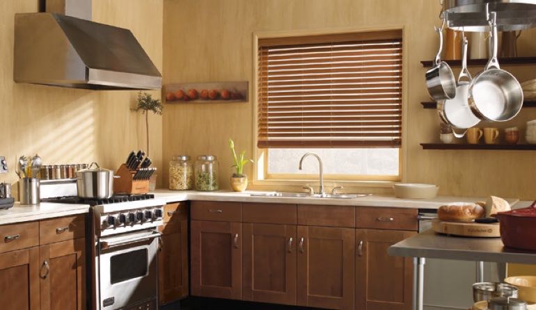 Faux wood blinds look beautiful in San Diego kitchens. San Diego kitchen faux wood blinds.