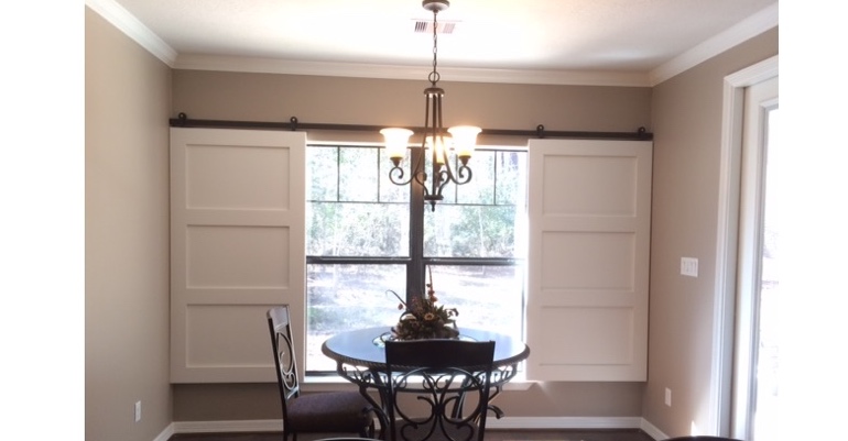 Barn doors open horizontally with slides instead of cords. San Diego barn door shutters