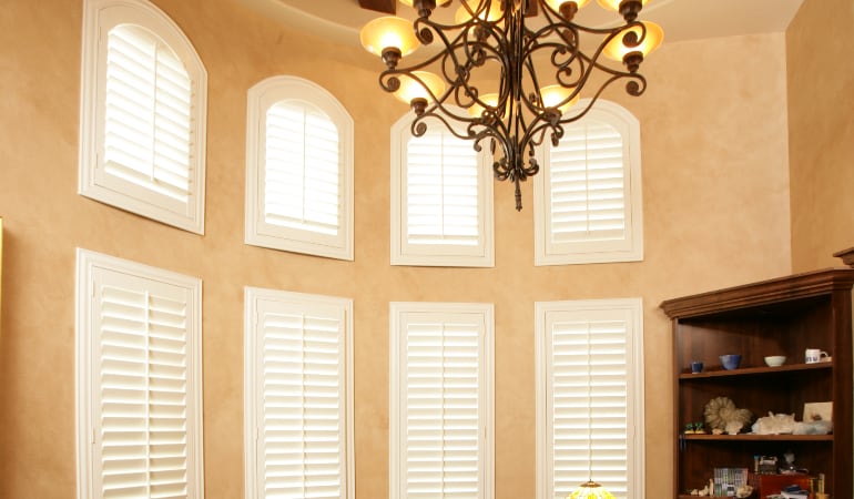 Polywood shutters can be custom made to fit any room. Polywood in a bow arched window