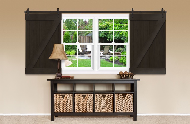 Brown Z-frame barn door shutters on a window 