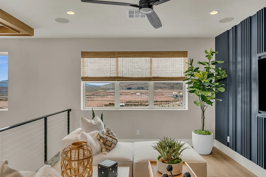 San Diego homeowners who want eco-friendly home fixtures should consider natural woven shades. Natural brown woven shades on a window in a stylish sitting area
