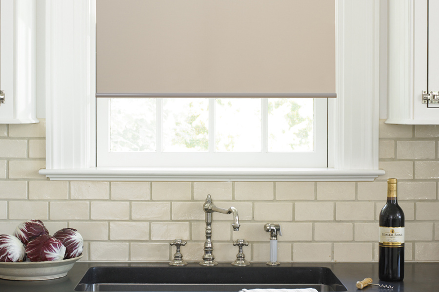 Roller shades opens up a lot of color and style options for your gourmet kitchen at San Diego. Roller shade above a kitchen sink.